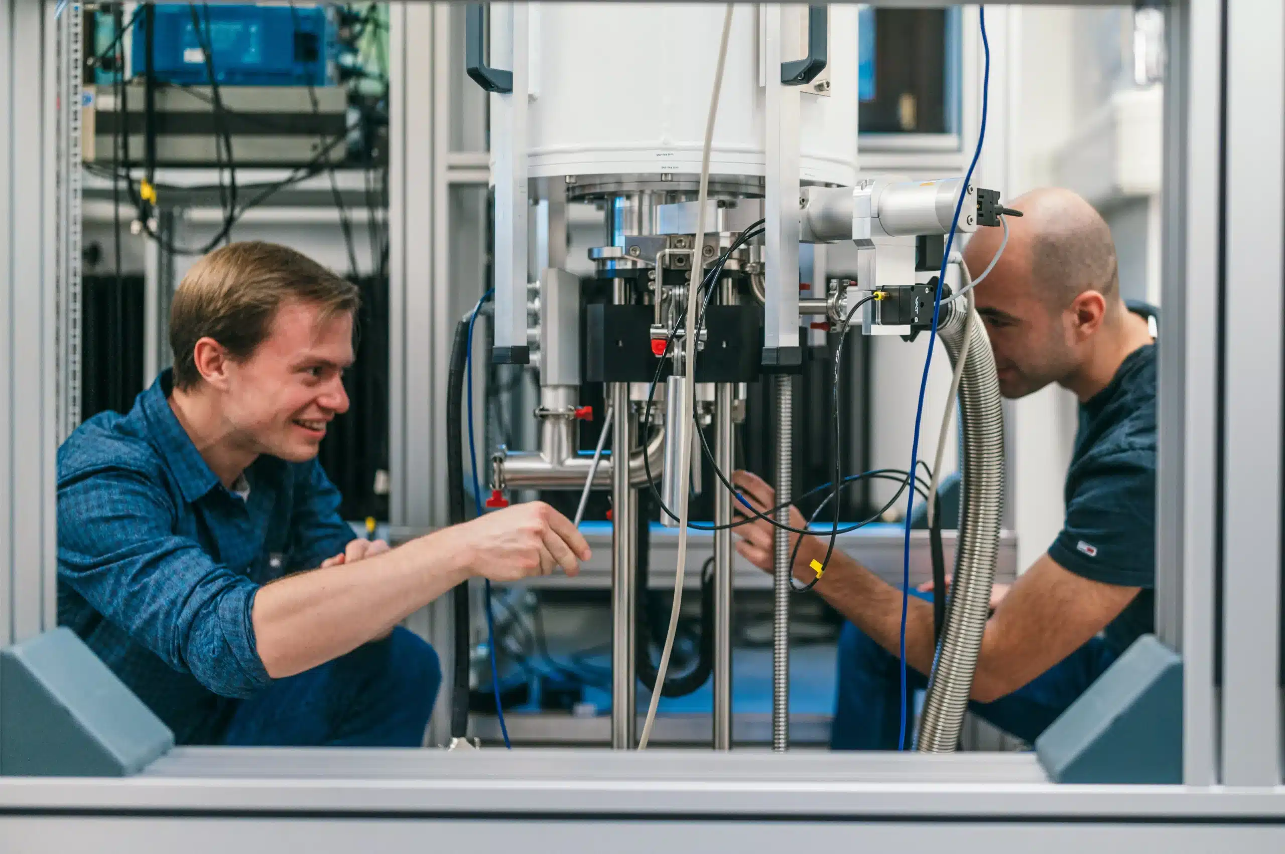 Two researchers working on magnetotransport experiments at University of Regensburg